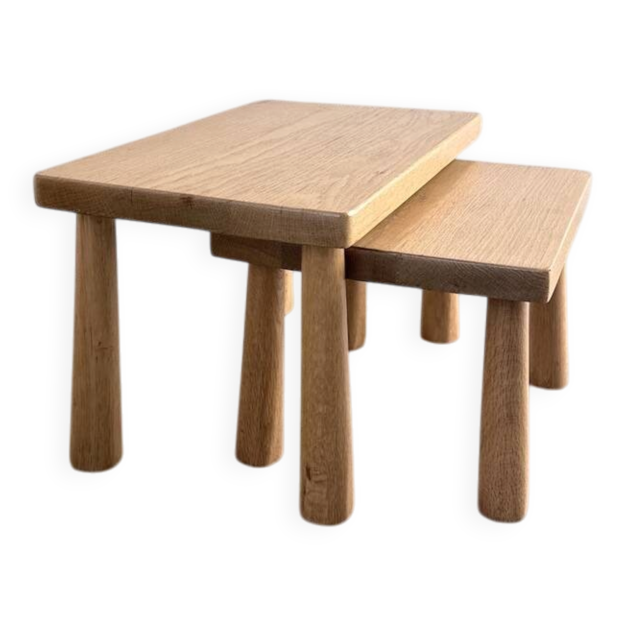 Two stools or small nesting tables in light oak.