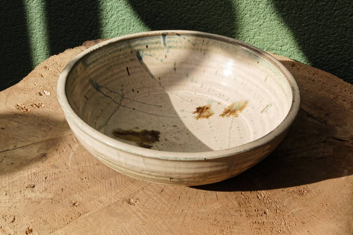 Hollow stoneware dish, signed Yves Loiselet