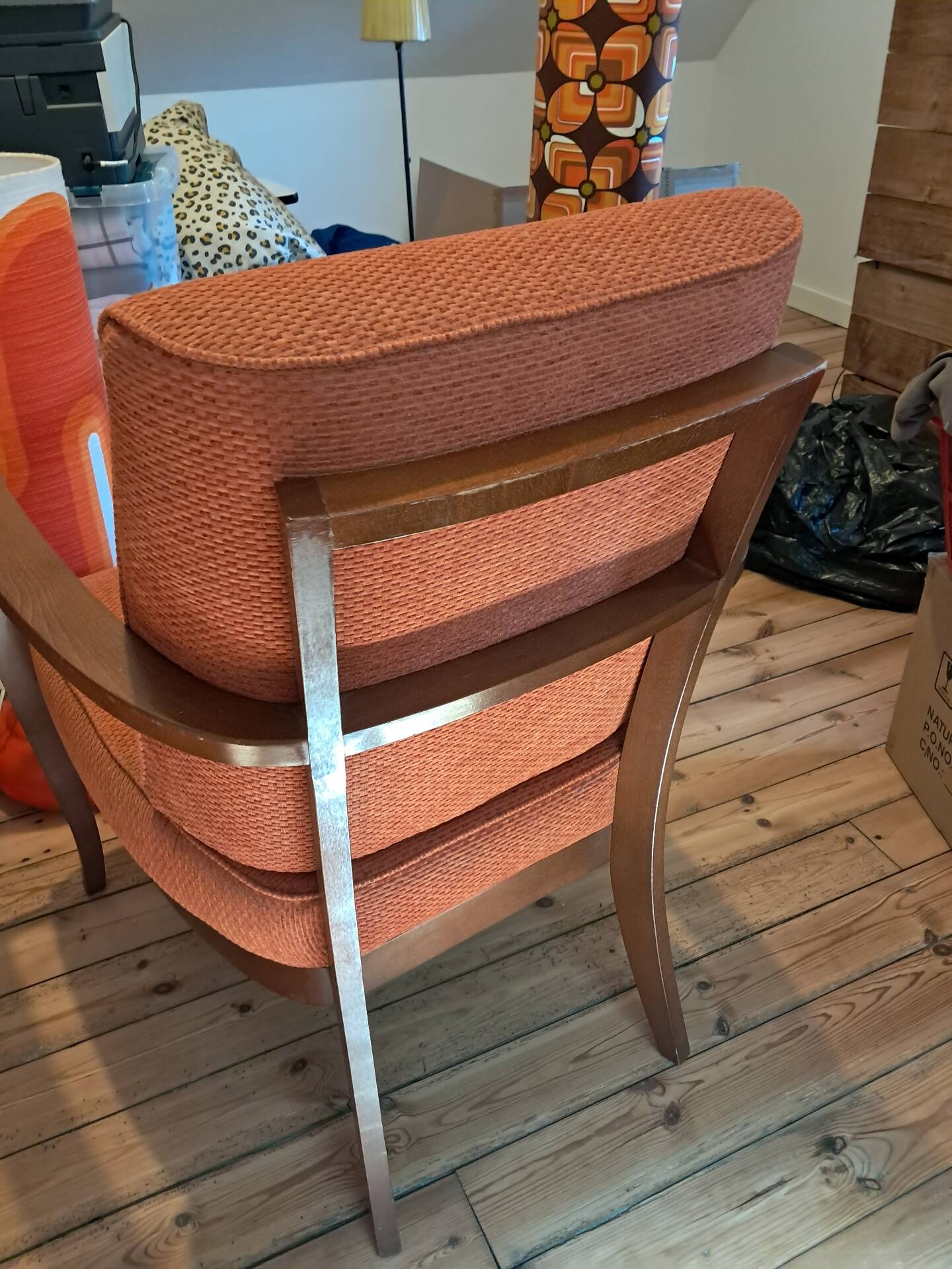 Vintage Art Deco armchair in curved wood and terracotta fabric.
