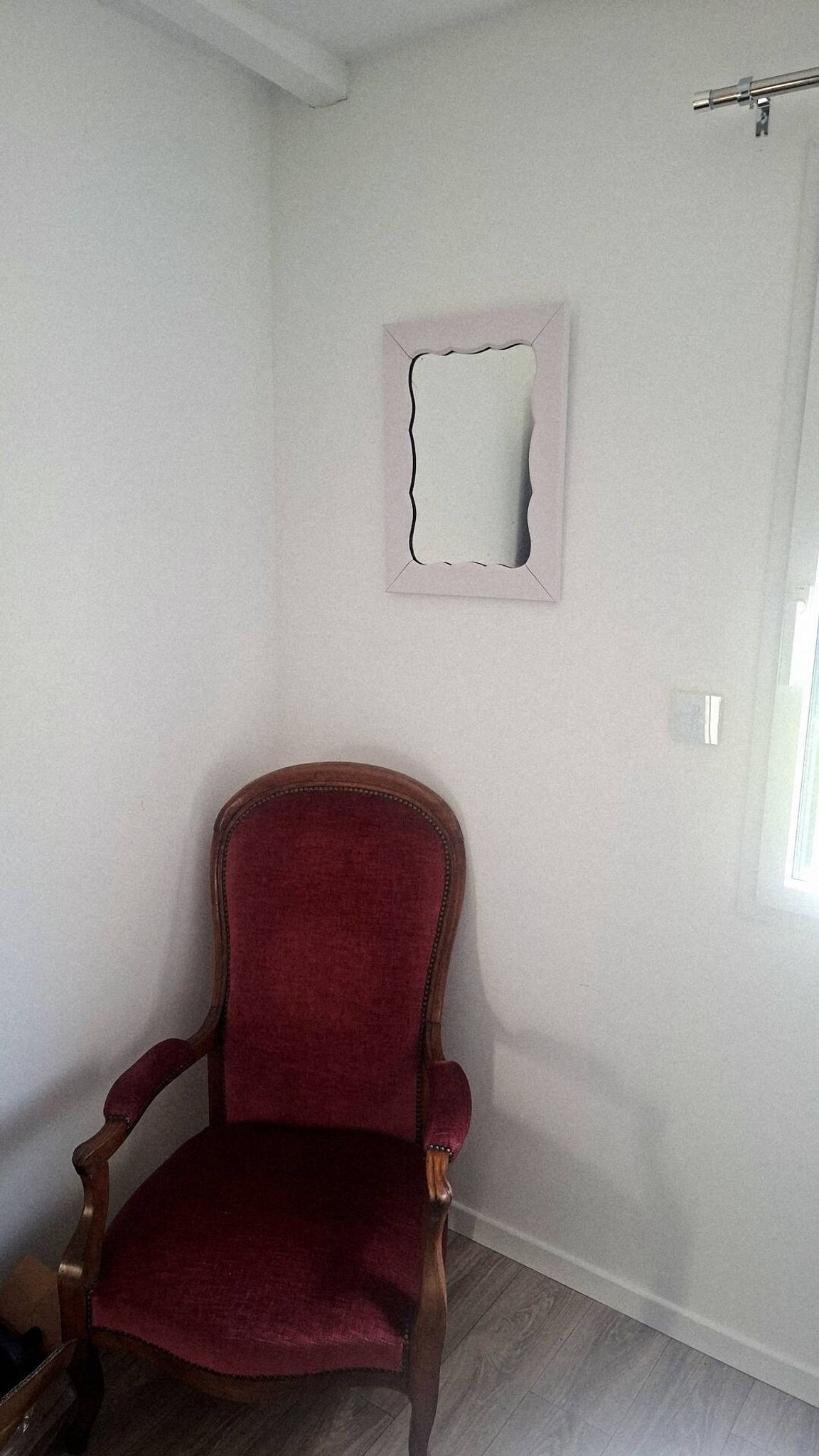Mid-20th century rectangular wall mirror with a powder pink frame.
