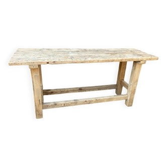 Primitive industrial table workbench in raw natural wood vintage bohemian trade store