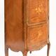 In-between furniture in marquetry decorated with a trophy decoration of musical instruments