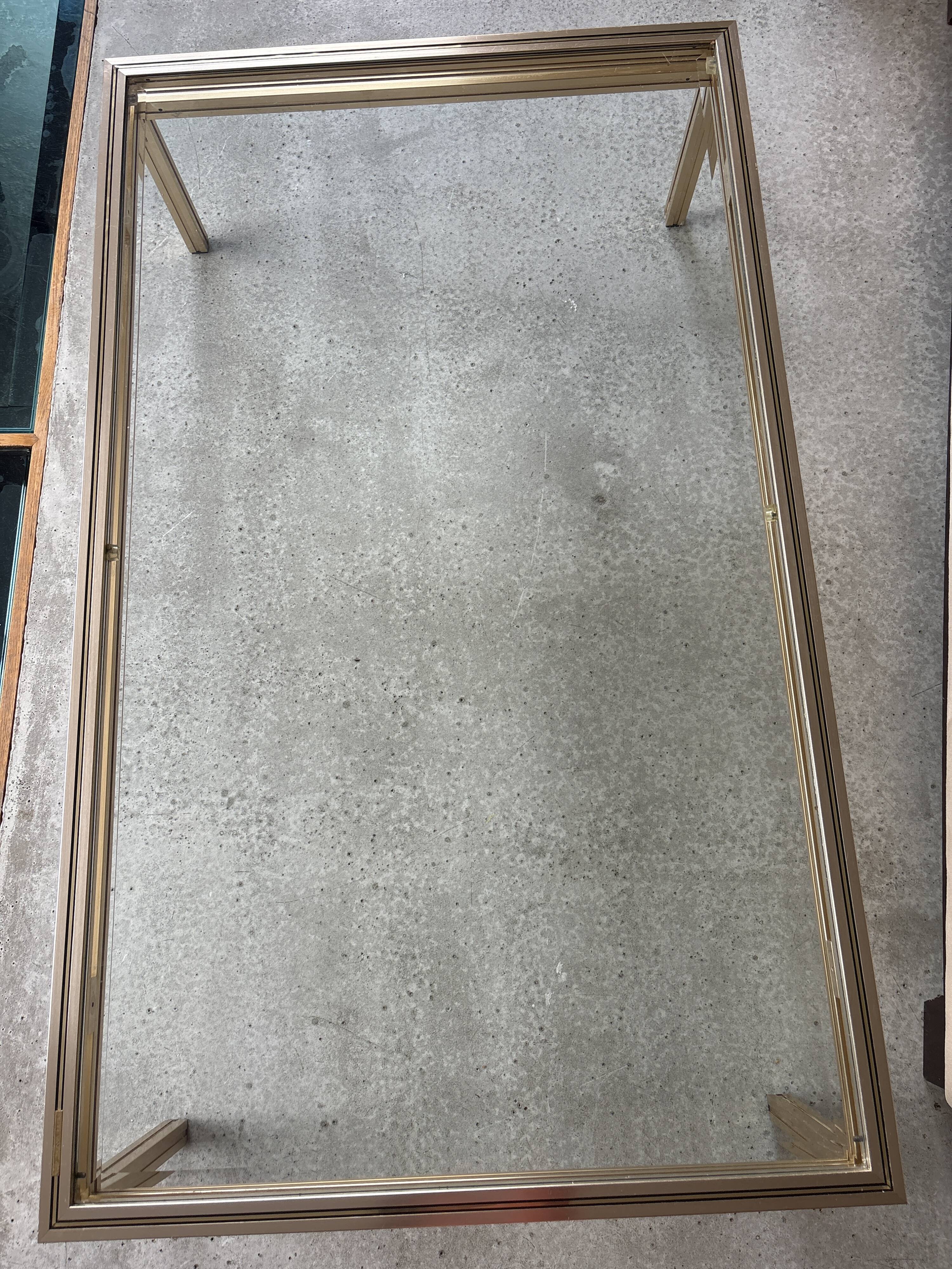 Brass/glass table designed by Pierre Vandel Paris