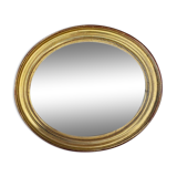 Golden oval mirror