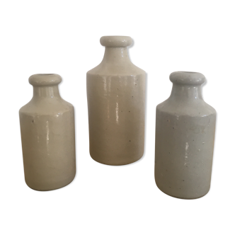 Three bottles of Mercure Bourdon Frères Paris sandstone