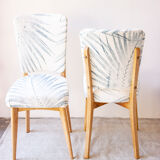 Pair of vintage chairs reupholstered with palm pattern fabric