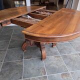 Extendable walnut table in the Napoleon III style.