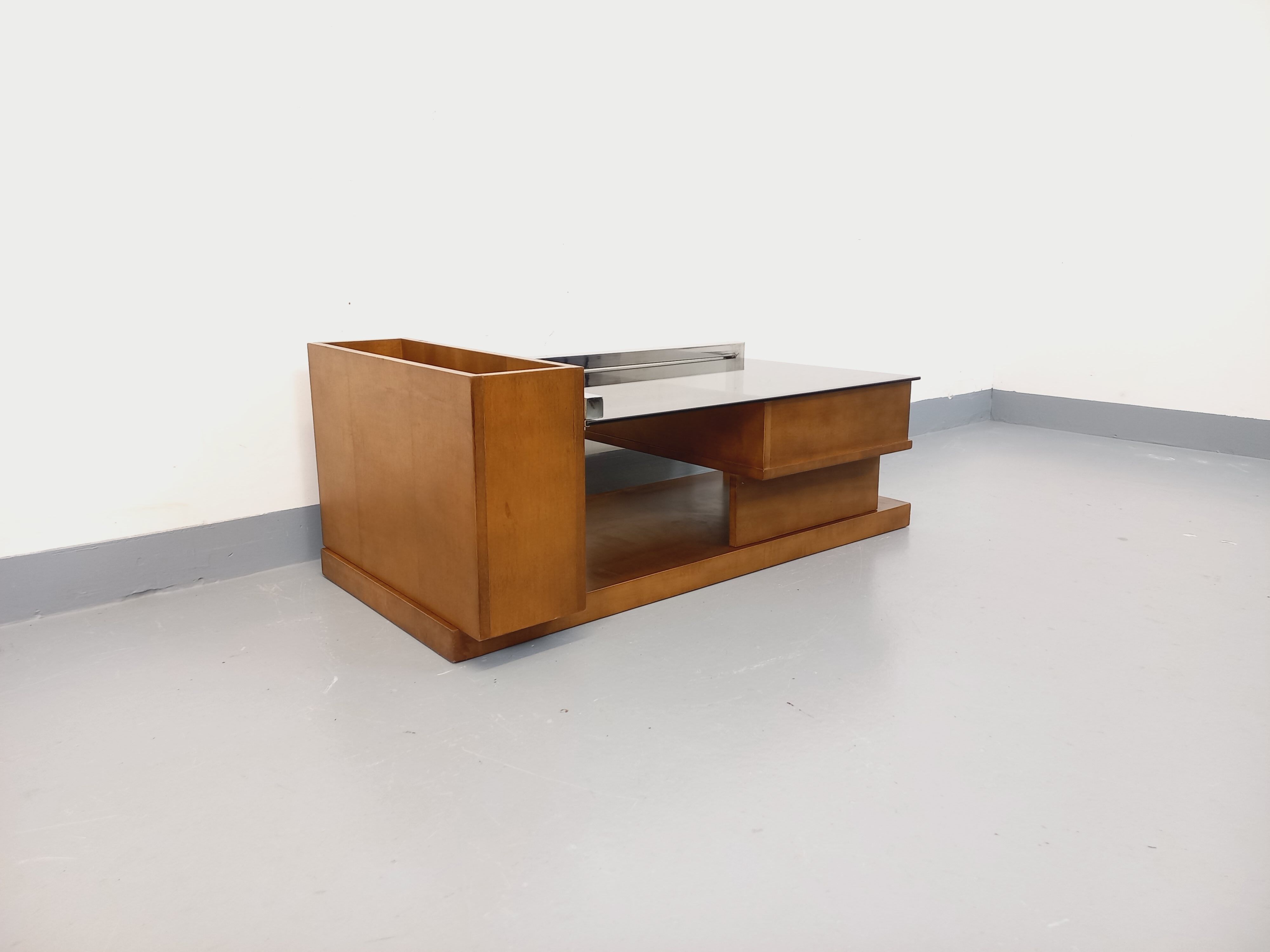 Rectangular vintage modernist coffee table with wooden niches, chrome.