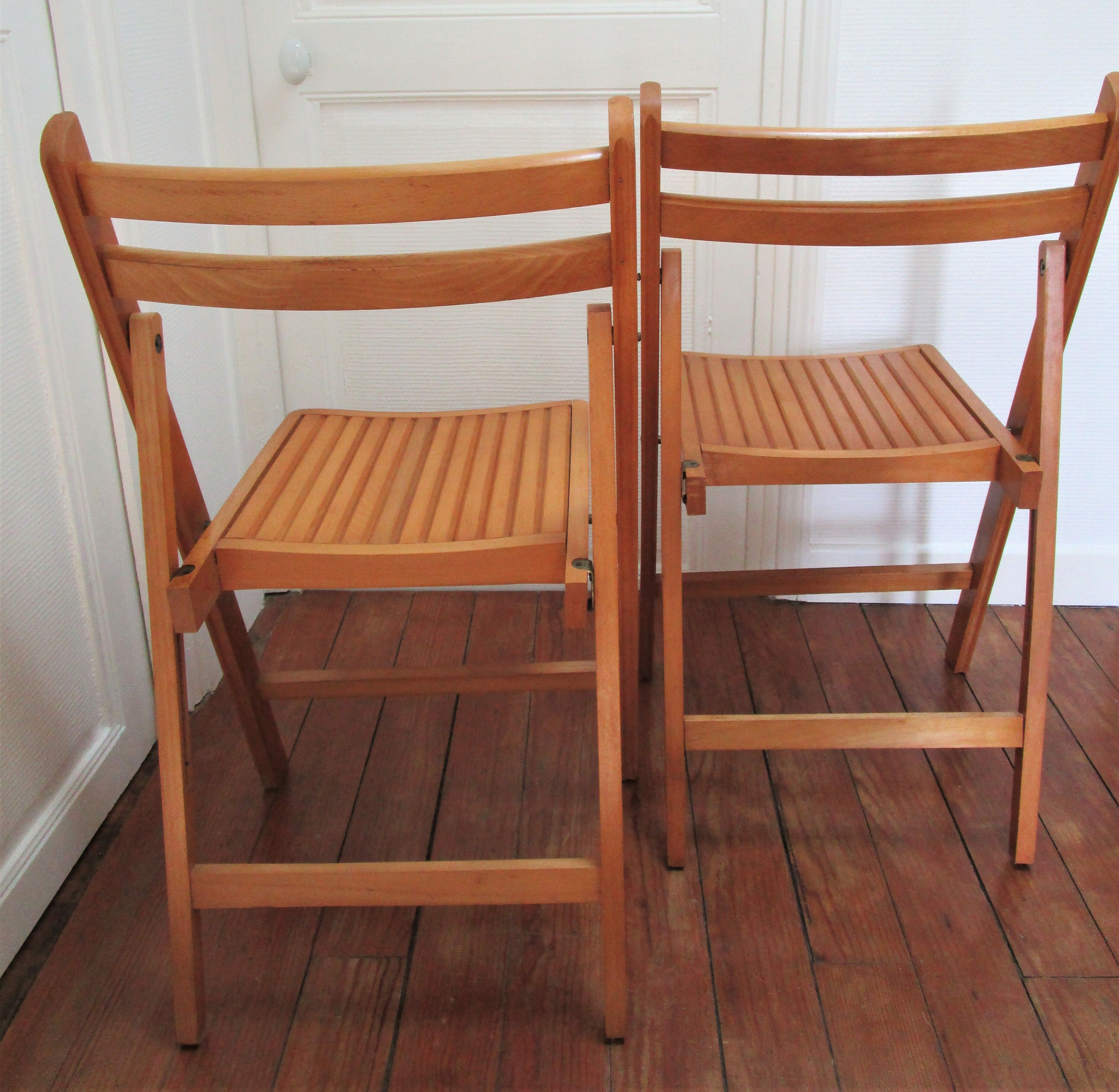 Pair of folding chairs with vintage solid wood slats