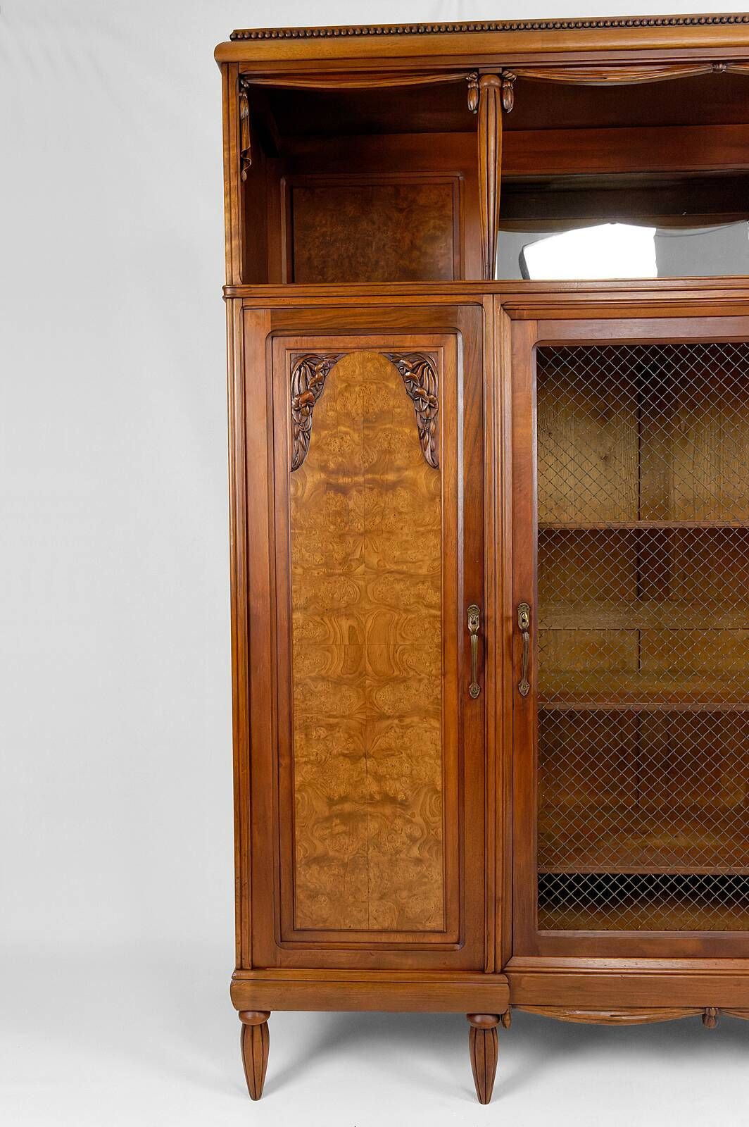 Art Deco showcase bookcase in carved walnut, France, circa 1925