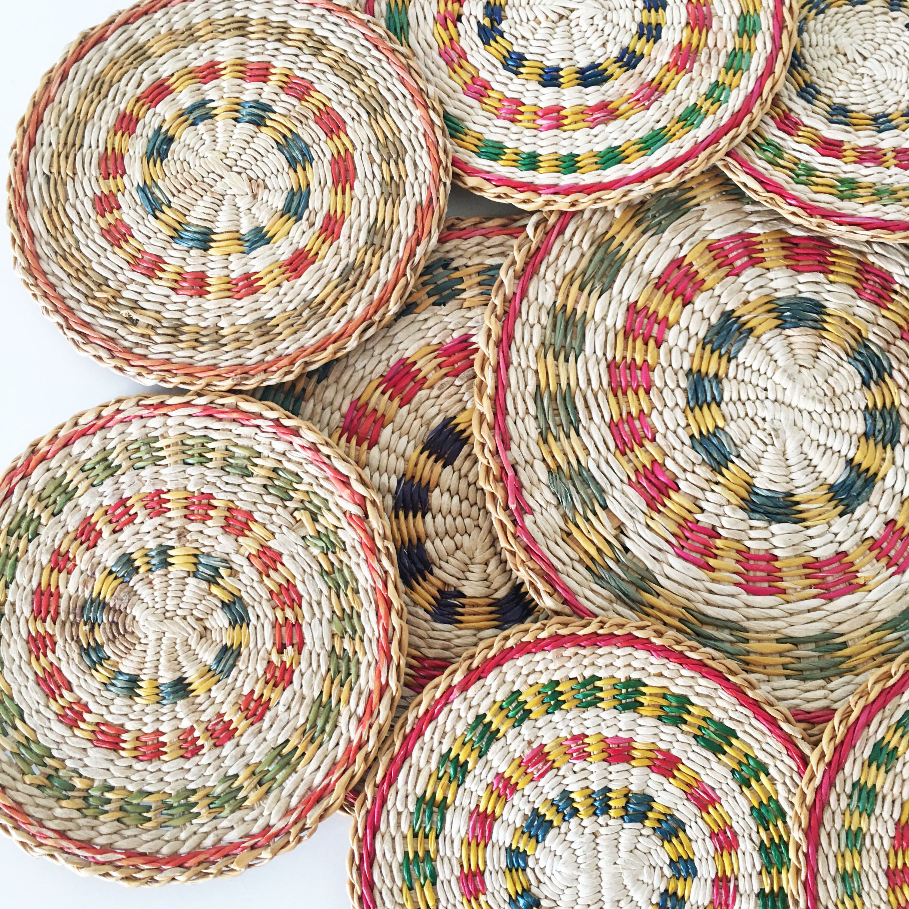 Set of coasters and bottles in colored wicker