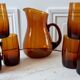 Ensemble composé d’un pichet et de 6 verres ambrés années 70
