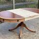 Round extendable table in Empire style, renovated with Bordeaux leather and raw wood, 168cm.