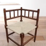 Antique Dutch oak corner chair with turned spindles and new rush seat