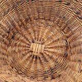 Old throne basket armchair in woven wicker