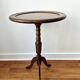 Small tripod wooden table with a vintage round top -