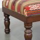 Oriental pouf upholstered in an antique kilim