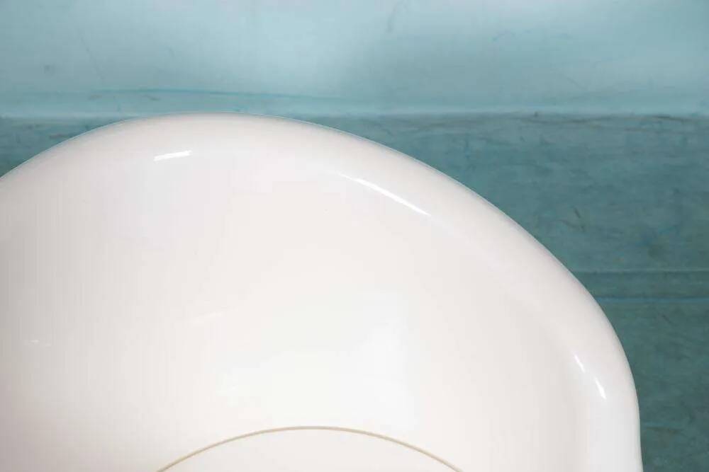 Space-age shell chair with storage, Ikea Popptorp chair.