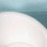 Space-age shell chair with storage, Ikea Popptorp chair.