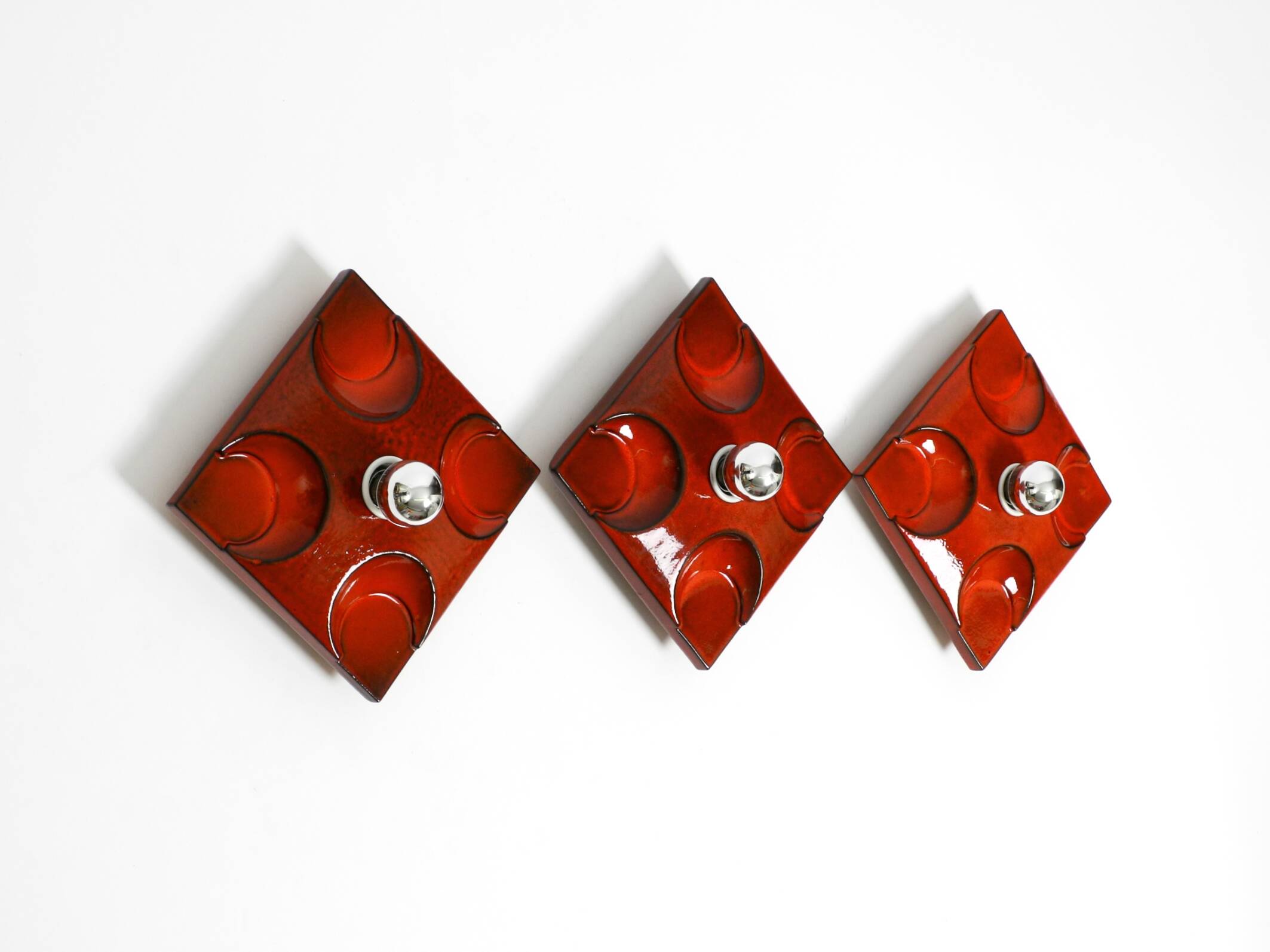 Three beautiful original 1970s Space Age red ceramic wall lamps