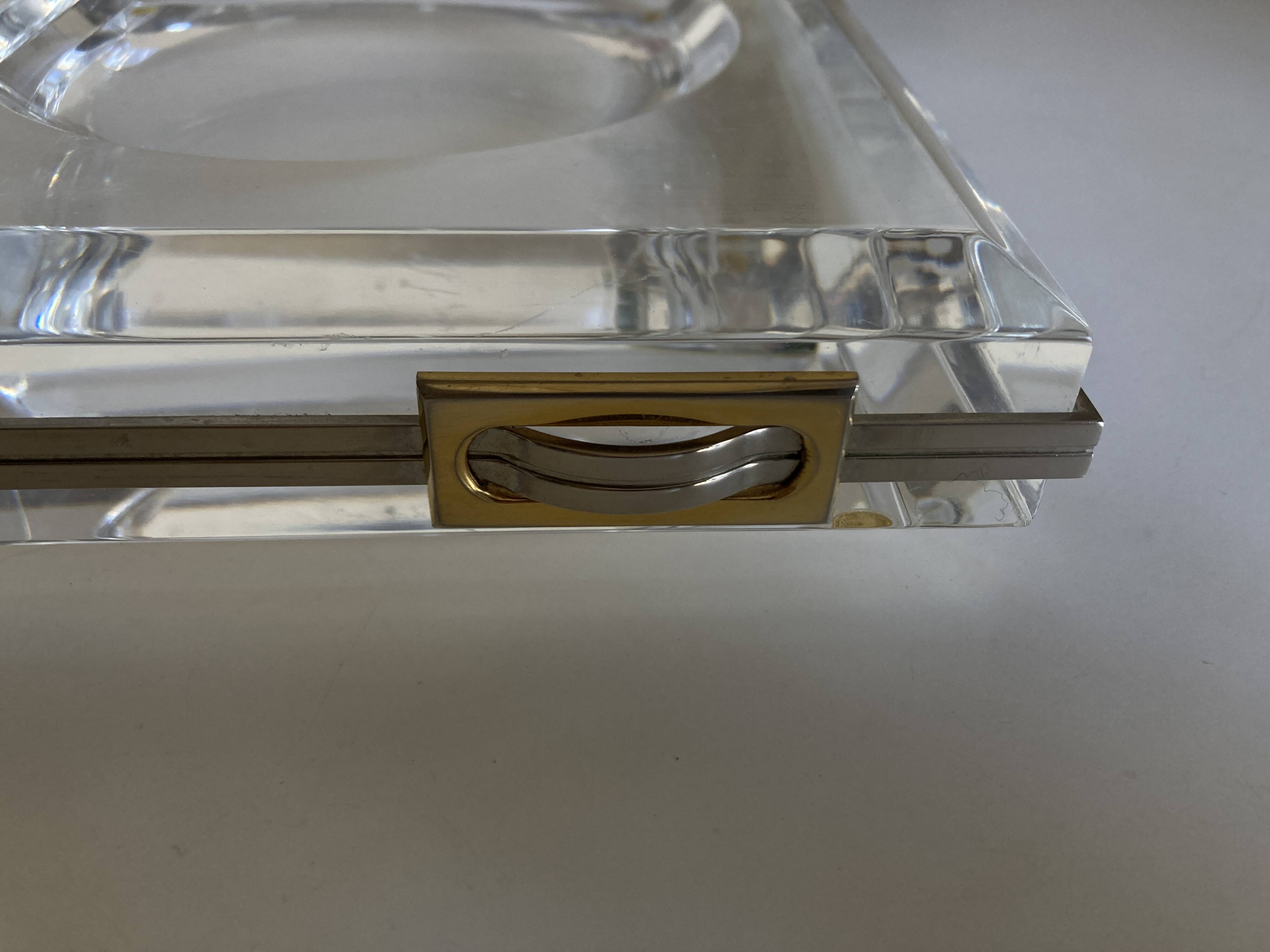 Plexiglas pocket emptier with brass and nickel silver surround, 1975, in the style of Pergay