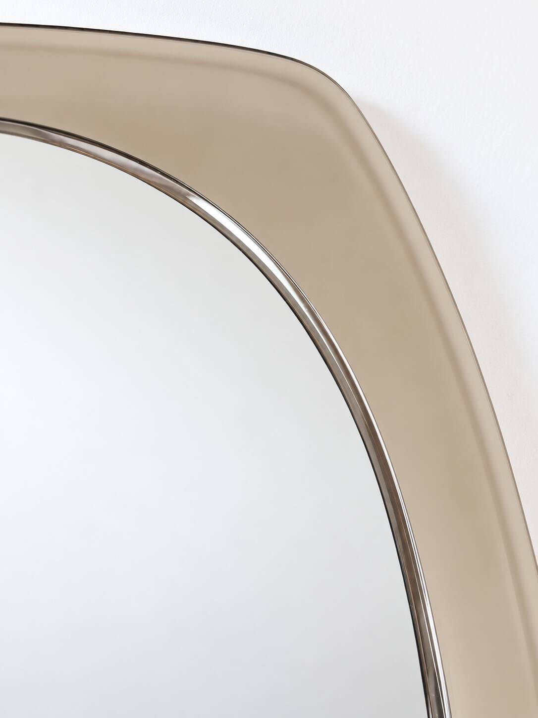 Vintage mirror with smoked glass frame from the 1970s.