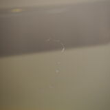 Smoked glass round dining table