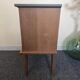 Renovated vintage bedside table in wood, with tapered legs – Matt green & gold background