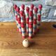 Former wooden tricolor bowling game with its ball