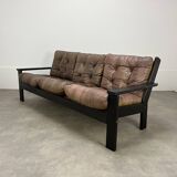 Living room sofa and brutalist armchairs in leather and wood, 70s, chalet style