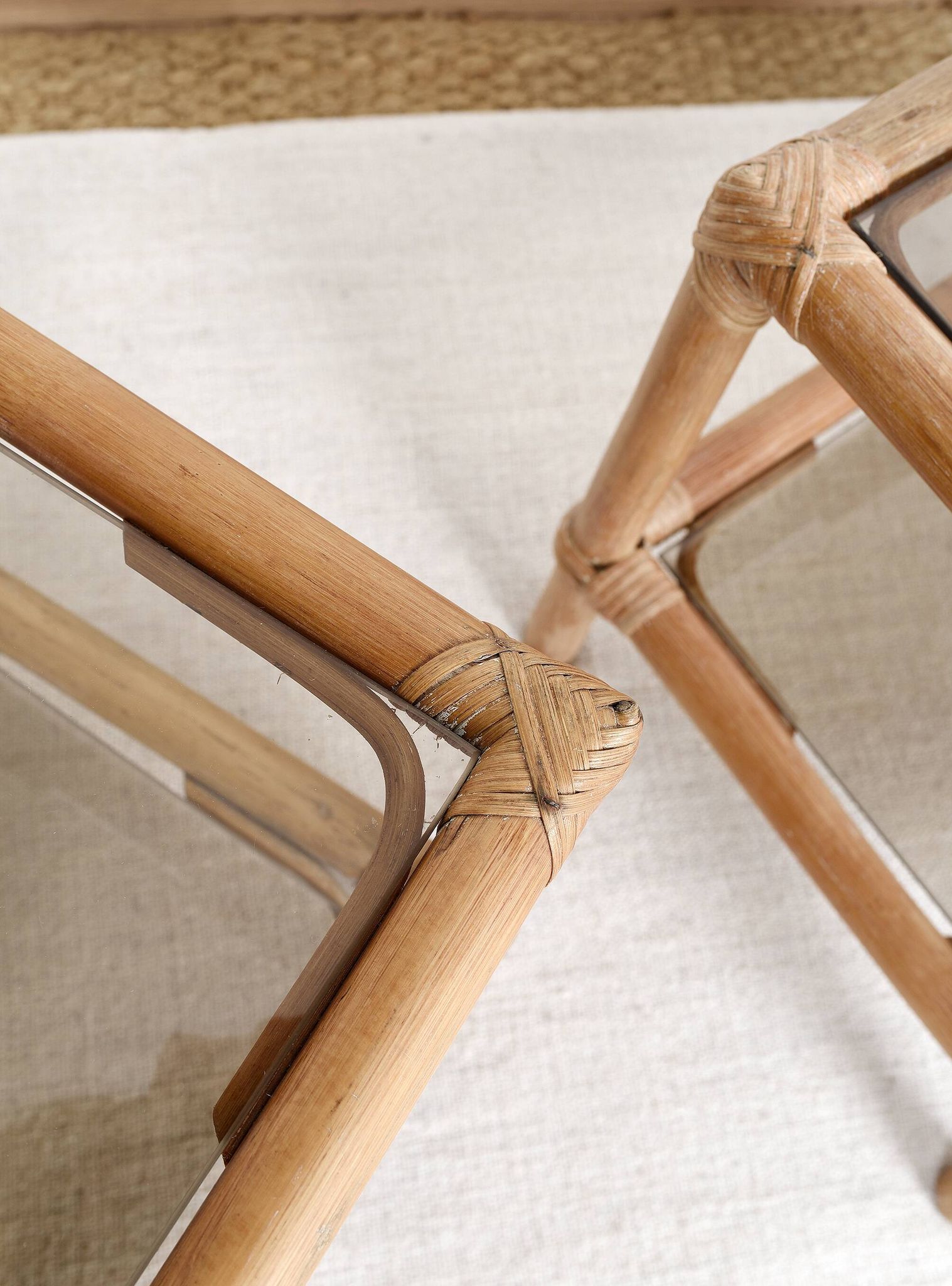 Pair of bedside tables or side tables, in rattan and smoked glass