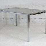Living table. chrome metal, curved smoked glass slab, france, circa 1970.