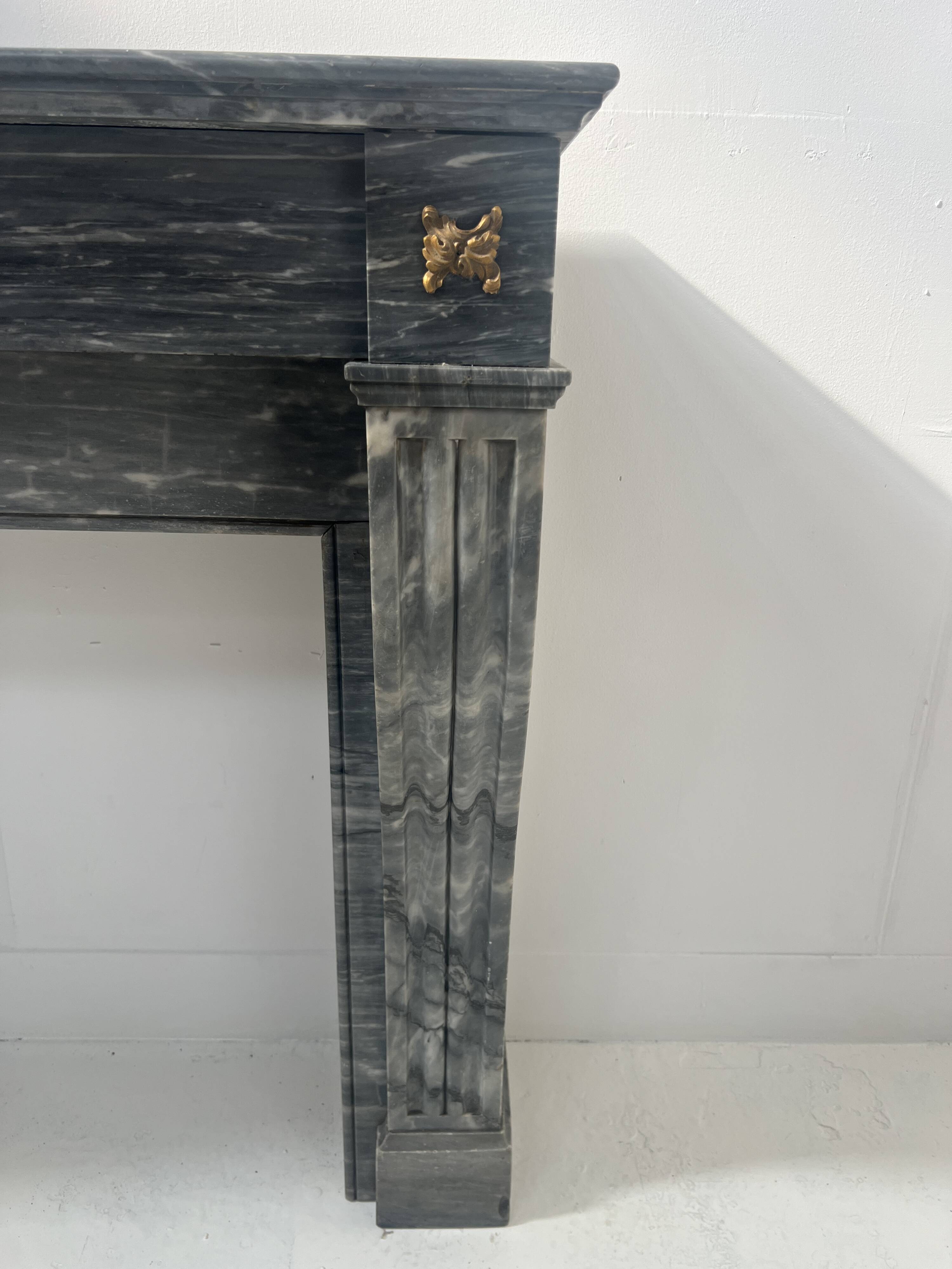 Napoleon III fireplace in blue Turquin marble from the 19th century.