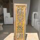 Rectangular Indonesian construction element with blue and yellow plant in carved wood
