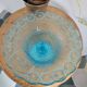 Plate on blue glass pedestal