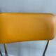 LM vintage chrome and orange/mustard yellow faux leather chairs