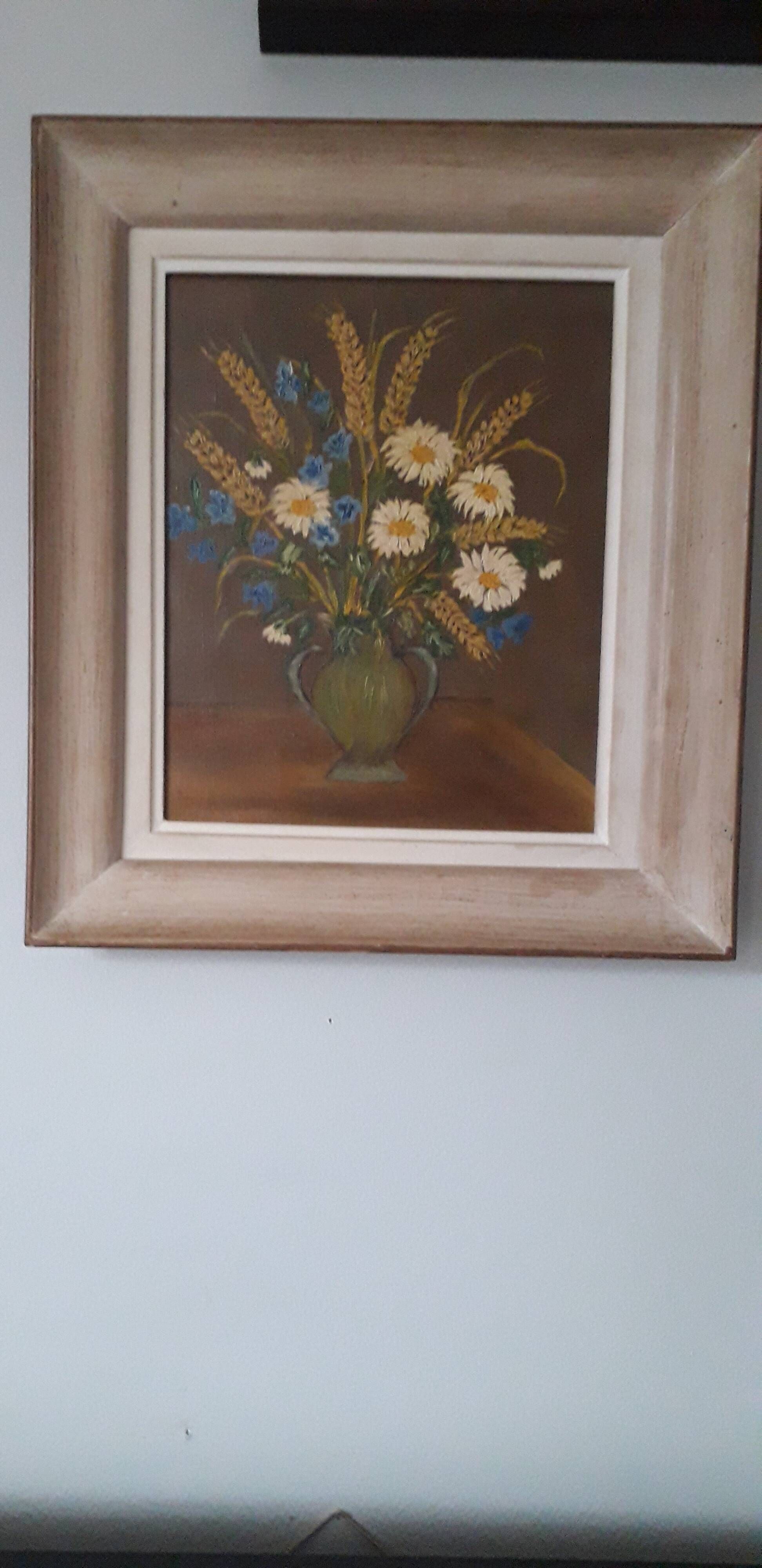 An old painting in oil on canvas depicting a bouquet of flowers.