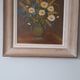 An old painting in oil on canvas depicting a bouquet of flowers.