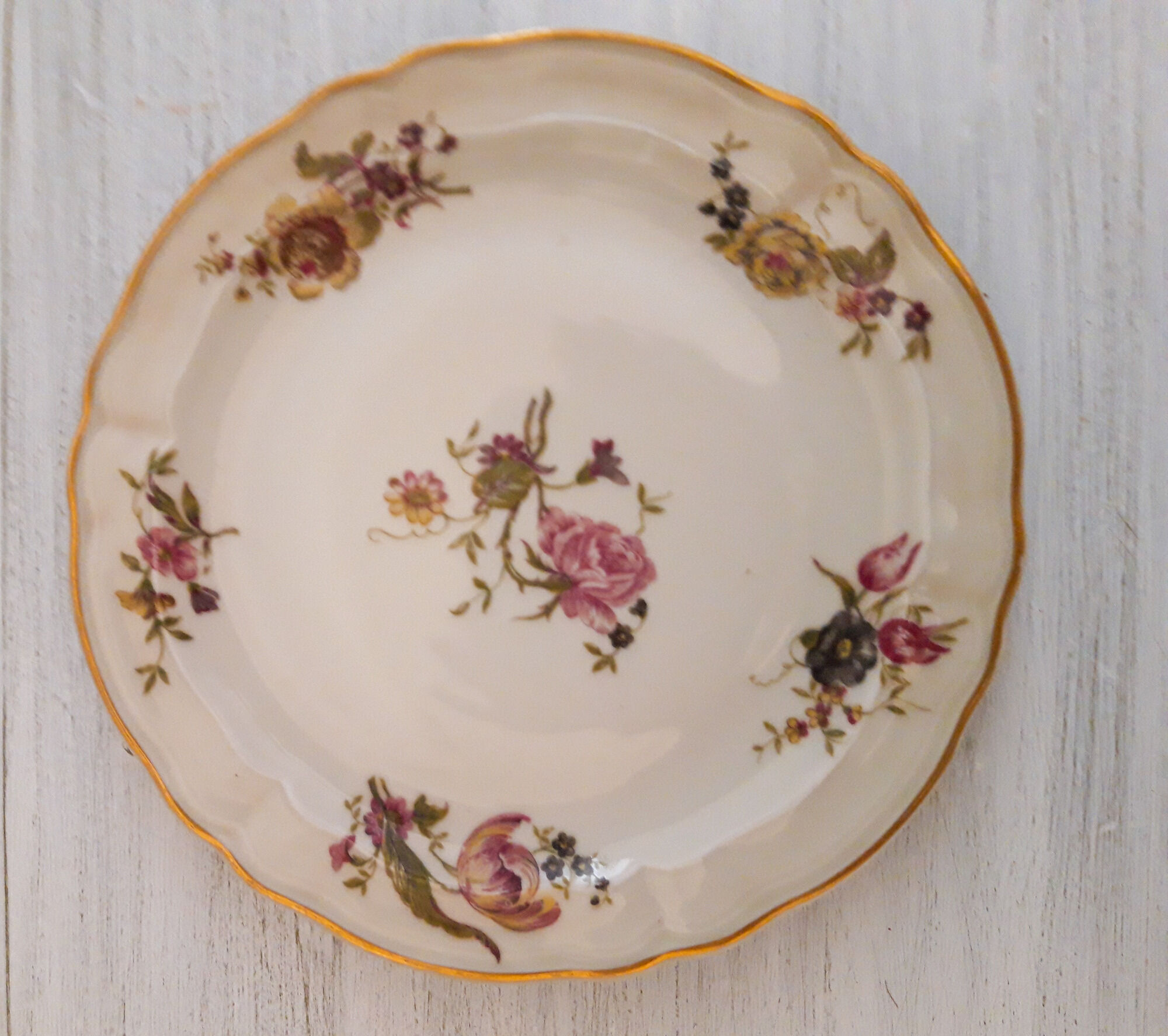 Set of porcelain dessert plates with flower patterns