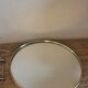 Antique round barber mirror in gilded metal