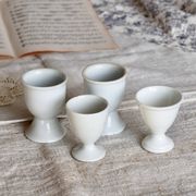 4 mismatched vintage white porcelain egg cups
