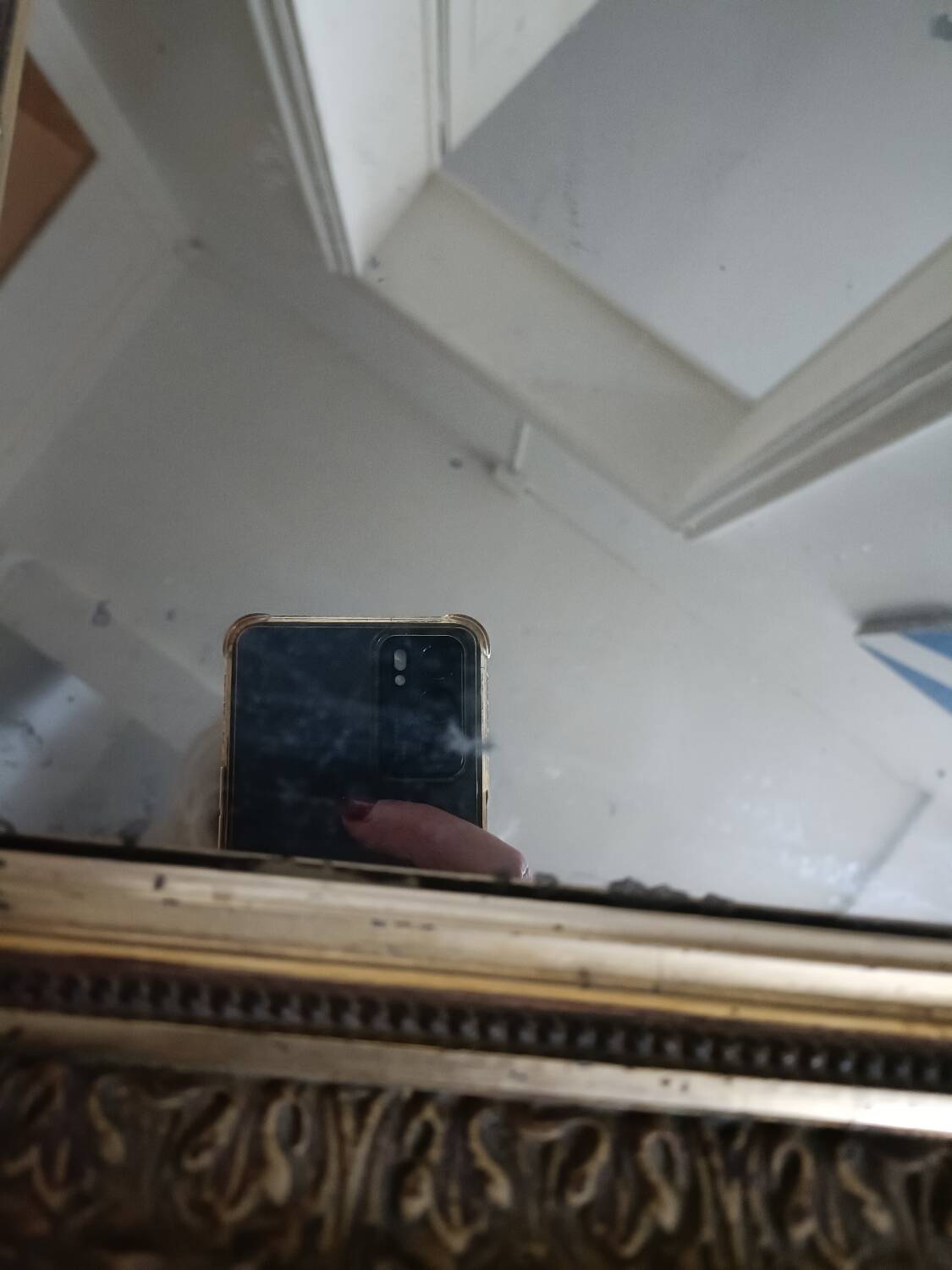 Antique mirror in wood and gilded stucco