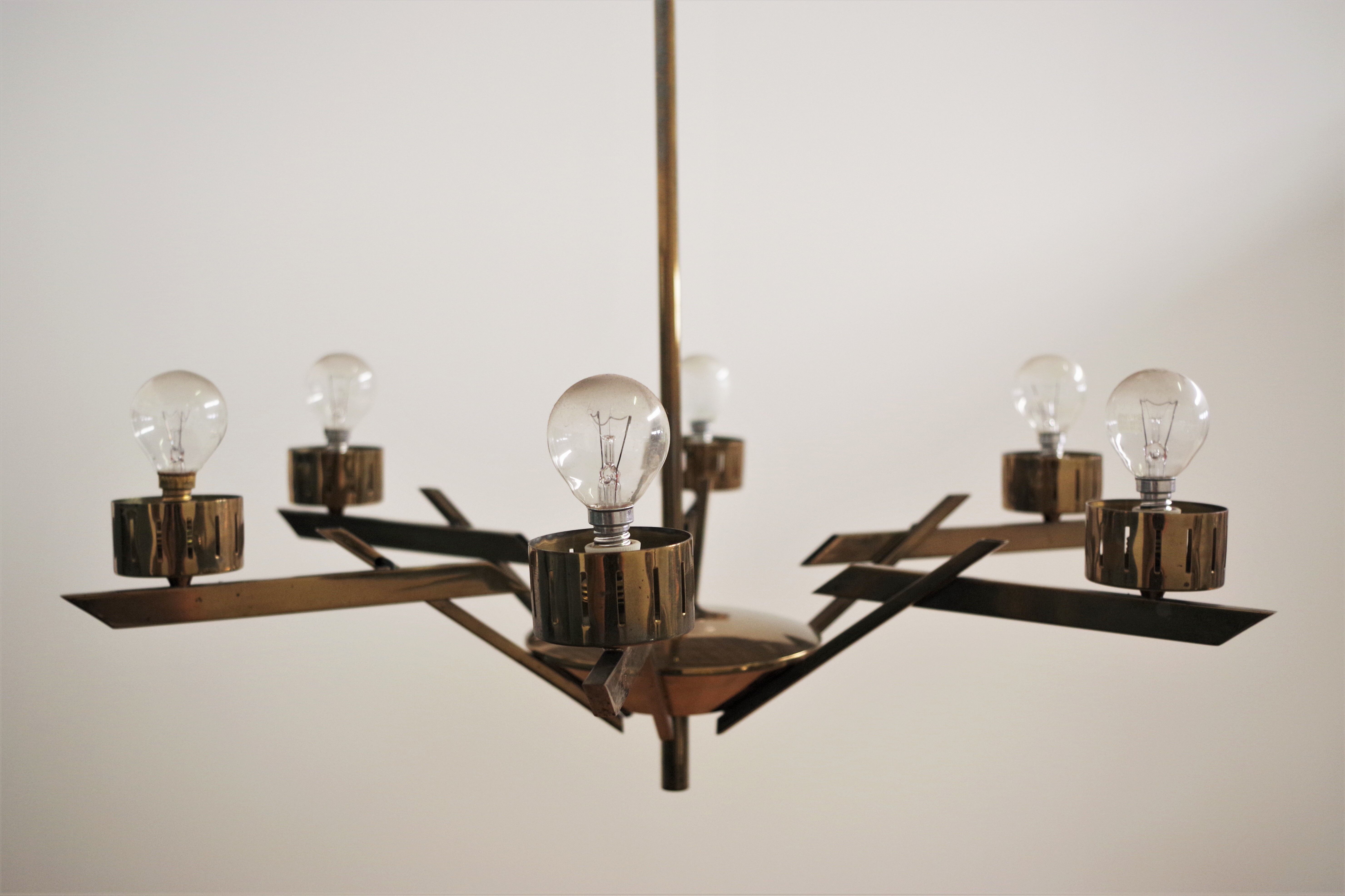 Vintage chandelier in brass and glass