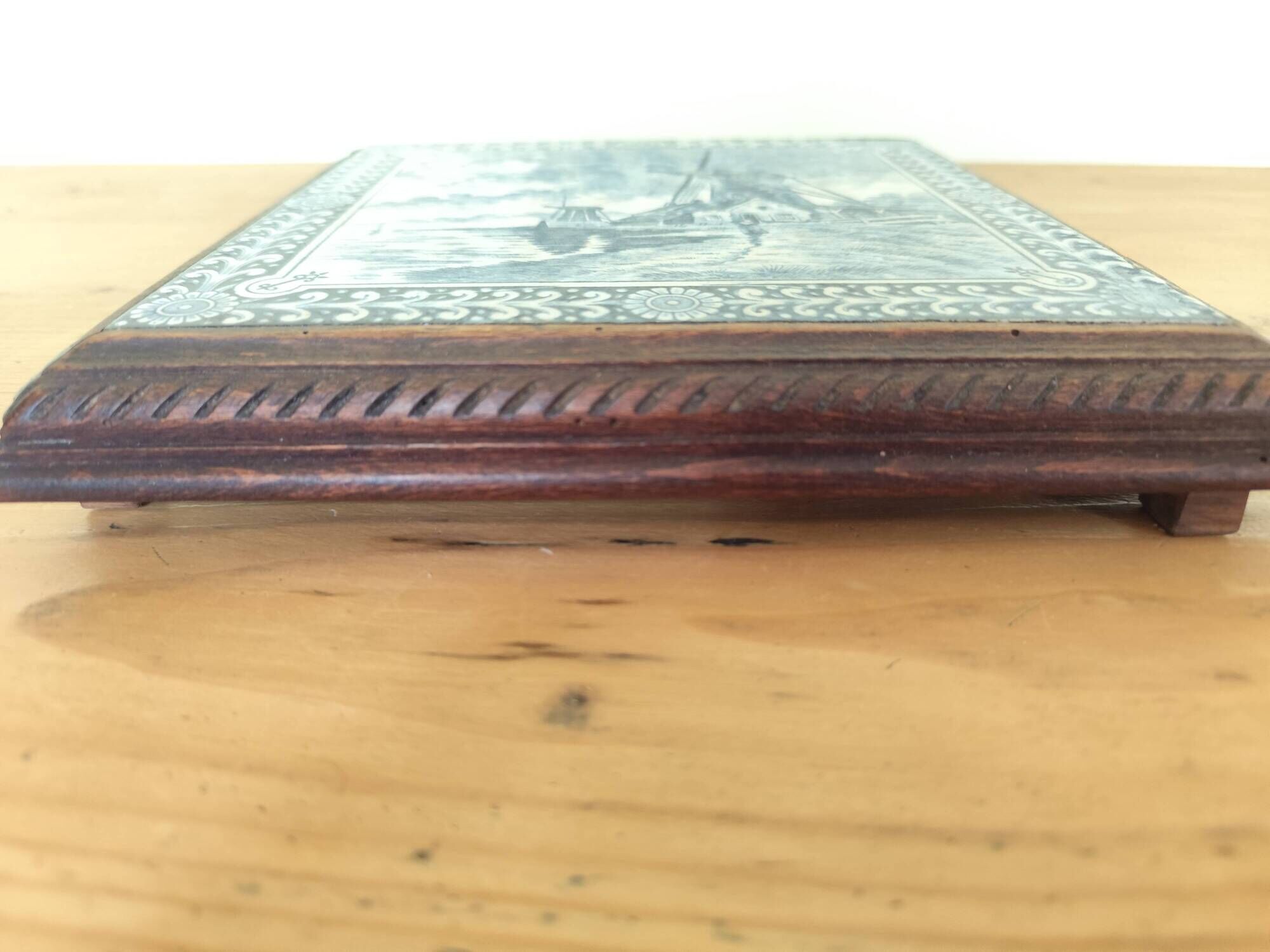 Ceramic tile trivet and wooden frame with Dutch windmill.