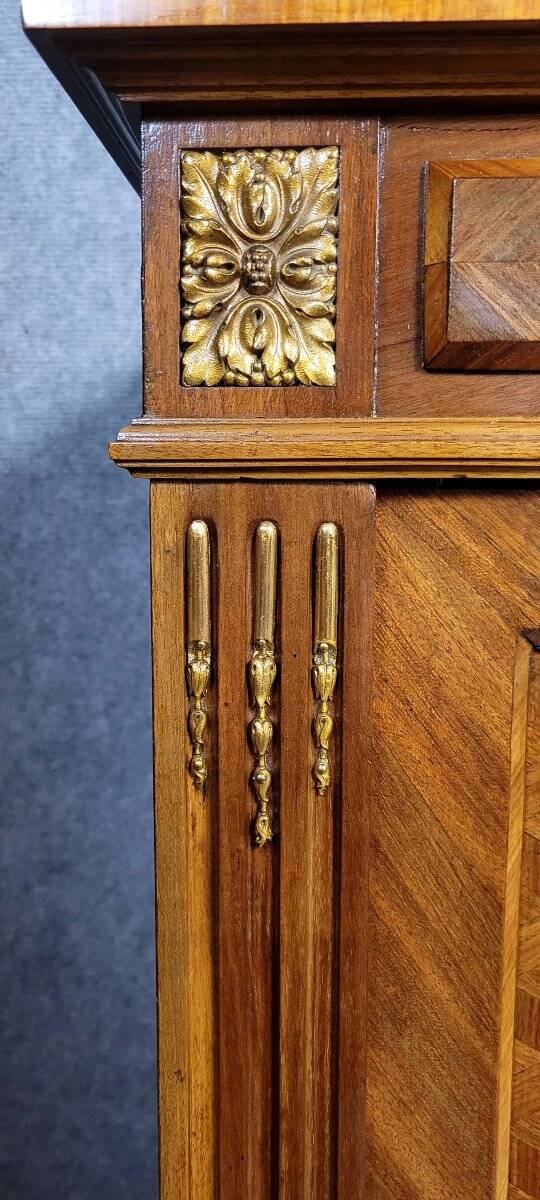 Important showcase library in fine wood and marquetry, stamped.