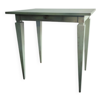 Green side table with tapered legs