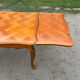 Antique extendable table in cherry wood and marquetry in the Louis XV style.