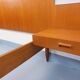 Double bed in vintage Scandinavian style from the 1960s with bedside tables.