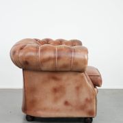 Chesterfield armchair in English style made of cowhide leather