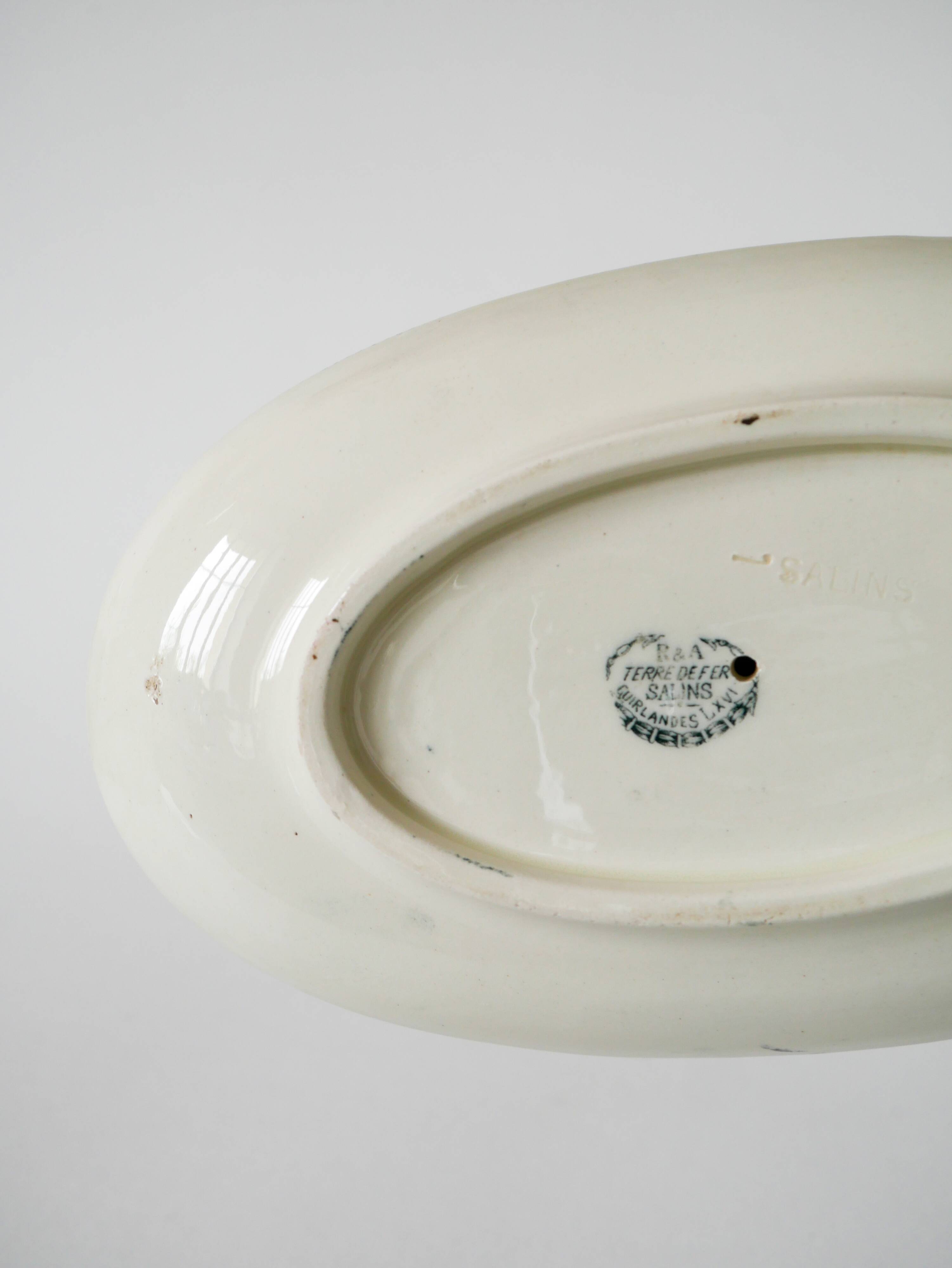 Sauce boat in Salins Iron Earth, "Guirlandes" model, textured version, early 20th century